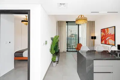 a kitchen and living room with a dining room at Escape24 Brand New 1BR with City View near Burj Khalifa in Dubai