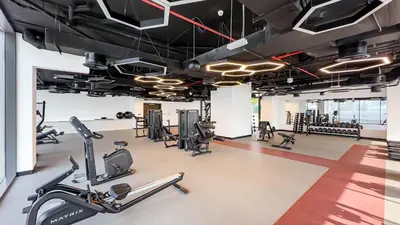 a gym with cardio machines and treadmills at Escape24 Brand New 1BR with City View near Burj Khalifa in Dubai