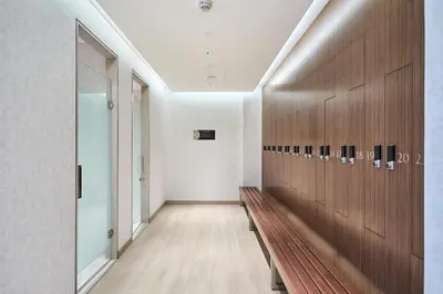 a hallway with a wooden bench in a building at STAY BY LATINEM Luxury 1BR Holiday Home CA 1506 Near Burj Khalifa in Dubai