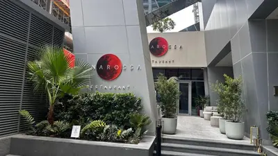 a building with signs on the side of it at Unwind in a Stylish Studio with Pool, Sauna, and Stunning City Views in Dubai