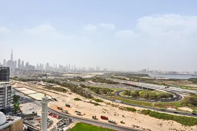 an aerial view of a highway with a city in the background at STAY BY LATINEM Luxury 1BR Holiday Home CA 1509 Near Downtown in Dubai