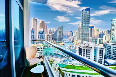 a room with a view of a city skyline at Barsana - Lavish 3BR Retreat - Marina & Sea Views in Dubai