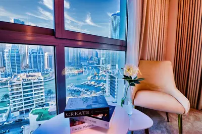 a room with a view of a city from a window at Barsana - Lavish 3BR Retreat - Marina & Sea Views in Dubai