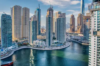 a view of a city with a river and skyscrapers at The Smart Concierge - Marina view in Dubai