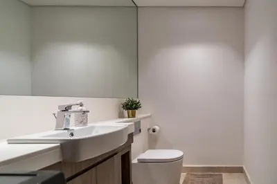 a bathroom with a sink and a toilet at Luxury 1 BR At The Sterling in Dubai