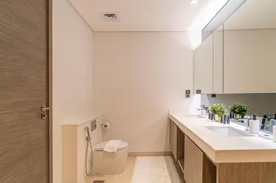 a bathroom with a sink and a toilet at Luxury 1 BR At The Sterling in Dubai