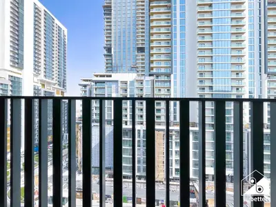 a view from a balcony of tall buildings at Luxury Studio in Meydan With Gym, Pool Access in Dubai