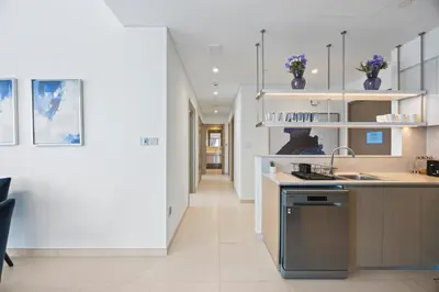 a kitchen with a sink and a counter top at 4BR Burj & Fountain View Luxe in Dubai