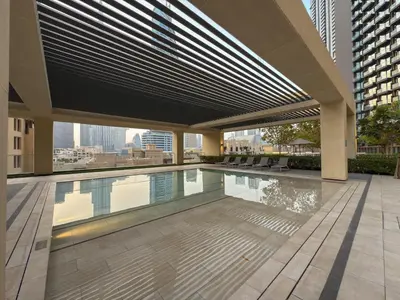 a swimming pool on the roof of a building at 4BR Burj & Fountain View Luxe in Dubai