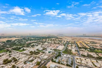 an aerial view of a city with buildings and the ocean at FIRST CLASS 1BR Modern Comfort in the City in Dubai