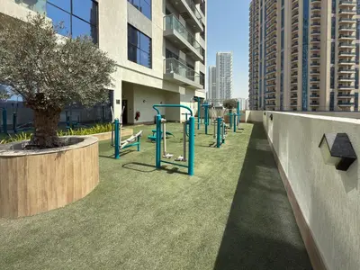 a park with a playground in a building at Vogue JVC Jeewar Tower near Circle Mall, One Bedroom Apartment with Balcony and City View, Access to all Amenities in Dubai
