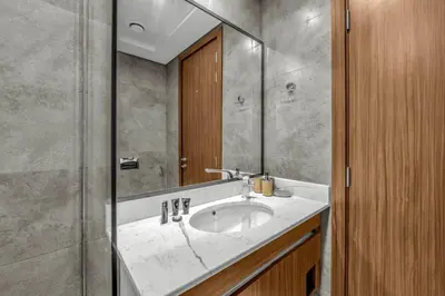 a bathroom with a sink and a mirror at Brand New Luxury 2 Bedroom in Dubai