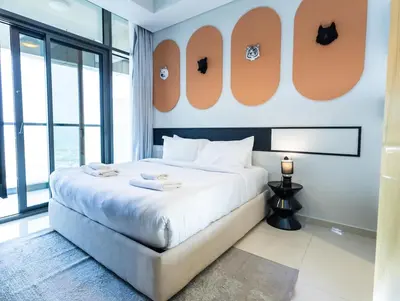 a bedroom with a large bed and a large window at Modern 2BR Apartment with Stunning City Views in Dubai