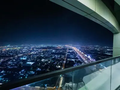 an aerial view of a city at night at Modern 2BR Apartment with Stunning City Views in Dubai