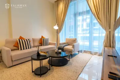 a living room with a couch and two chairs at Elegant 1 BR Apartment in J One Tower in Dubai