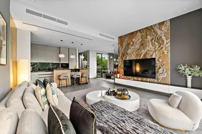 a living room with a couch and a table at FIRST CLASS Villa Private Pool & Garden Bliss in Dubai