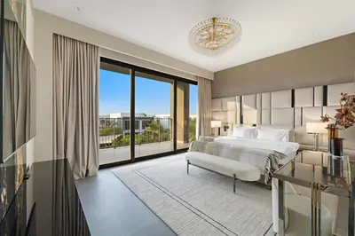 a bedroom with a bed and a large window at FIRST CLASS Villa Private Pool & Garden Bliss in Dubai