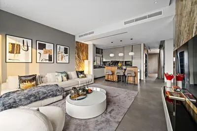 a living room with a couch and a table at FIRST CLASS Villa Private Pool & Garden Bliss in Dubai