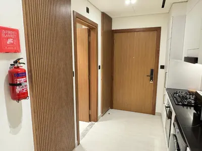 a room with a fire hydrant and a door to a kitchen at DVR Studio Apartment with private jaccuzi in Trillionaire by Binghatti Business Bay in Dubai