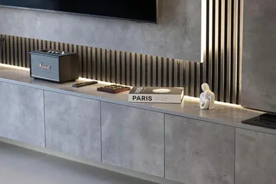 a reception counter in a store with a sign that says pans at Restay Homes at Act Towers by Emaar - Pool access with Burj View included - Luxury Apartments in Downtown in Dubai