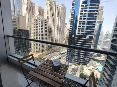 a balcony with a bench and a view of a city at Bay View in Marina Bay in Dubai