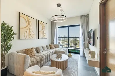 a living room with a couch and a table at Stylish 1BR with City and Partial Burj View by BMS in Dubai