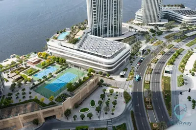 an aerial view of a city with a large building at Waterfront Breathtaking 2BR Pool Burj Views Sleeps 7 in Dubai