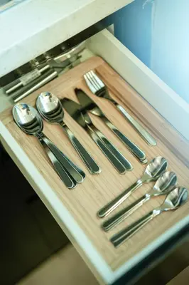 a tray with silver utensils on a table at Damac Maison Canal Views, Luxury Waterfront Apartment, 2 BR, Dedicated Office, Sleeps 6 in Dubai