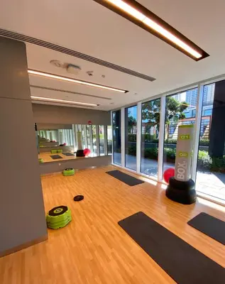 an empty room with yoga mats on the floor at Homely Creek Harbour Apartment - Direct Park Access in Dubai