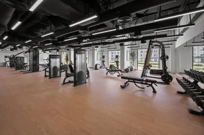 a gym with lots of treadmills and exercise equipment at Luxury 1BR Apartment Dubai in Dubai