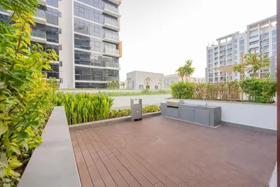 a patio in a building with buildings in the background at Modern Studio Retreat in Dubai in Dubai