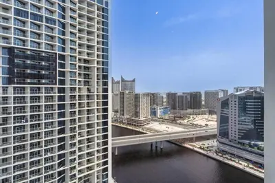 a view of a city with a river and buildings at Canal View & High Floor & Valet in Dubai