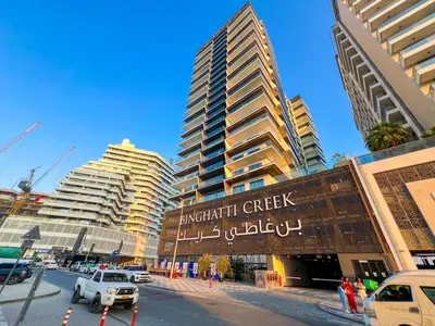 a city with tall buildings and a street with cars at 1 Bedroom Dream Stay- Binghatti in Dubai