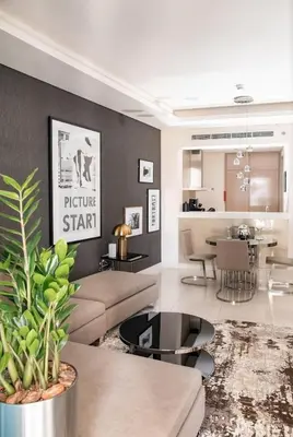 a living room with a couch and a table at Stylish 1BR in Damac by Paramount Business Bay in Dubai