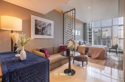 a living room with a couch and a table at Waterfront Studio in Business Bay near Burj Khalifa in Dubai