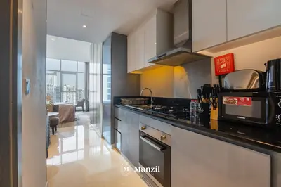 a kitchen with a stove and a counter top at Waterfront Studio in Business Bay near Burj Khalifa in Dubai