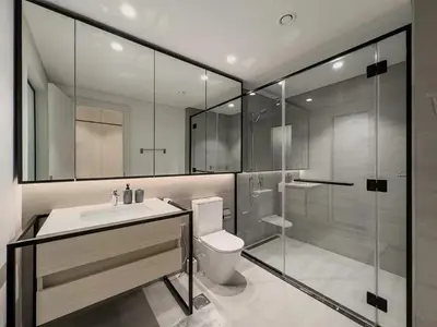 a bathroom with a shower and a toilet and a sink at Amazing Brand New 1BR in Dubai