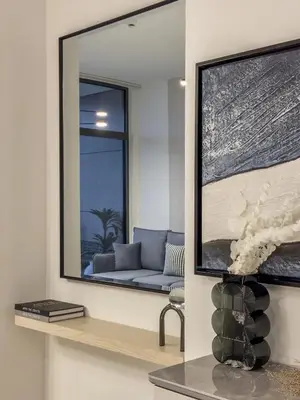a living room with a mirror and a couch at Amazing Brand New 1BR in Dubai