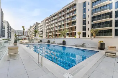 an image of a swimming pool at a hotel at Stylish City Studio with Burj Khalifa View in Dubai