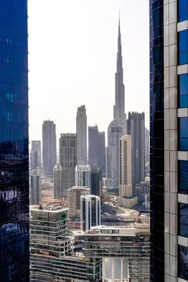 a view of a city skyline from a skyscraper at High Floor Burj Khalifa View Luxurious 1BR in Dubai