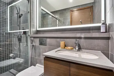 a bathroom with a sink and a shower at STAY BY LATINEM Luxury 1BR Holiday Home CC 0813 Near Downtown in Dubai