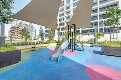 a playground in a building with a slide at 2BR Guest Favorite Elegant Apartment at Riviera 67 in Dubai