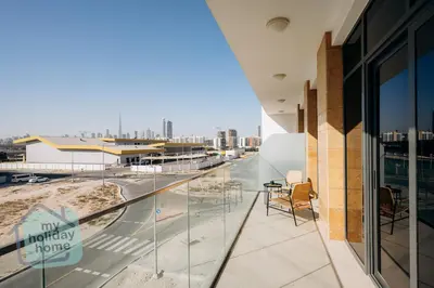a balcony of a building with a view of a city at Exclusive 2BR With City View Pool & Gym Access in Dubai