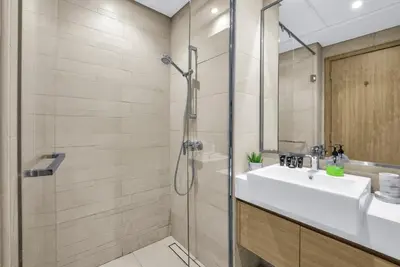 a bathroom with a sink and a shower at Exclusive Downtown Dubai Studio in Dubai