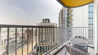 a balcony with a view of a city at The Crest A - Premium Two Bedroom High-Rise Escape in Dubai