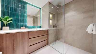 a bathroom with a shower and a sink at Al Dabas - One Bed with Beach Access and Sea View in Dubai
