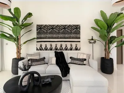 a living room with two white couches and plants at Cozy Luxury One Bedroom Sea View on Private Beach and Infinity Pool in Dubai