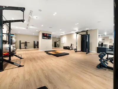 a gym with treadmills and machines in a room at Cozy Luxury One Bedroom Sea View on Private Beach and Infinity Pool in Dubai