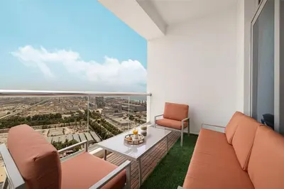 a living room with a couch and a table at Lux 3 BR Sea View Condo with Pool & Sauna In Marina in Dubai