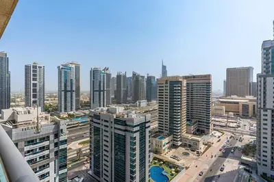 an aerial view of a city with tall buildings at Chic 1BR with City Views Near Marina & Metro in Dubai